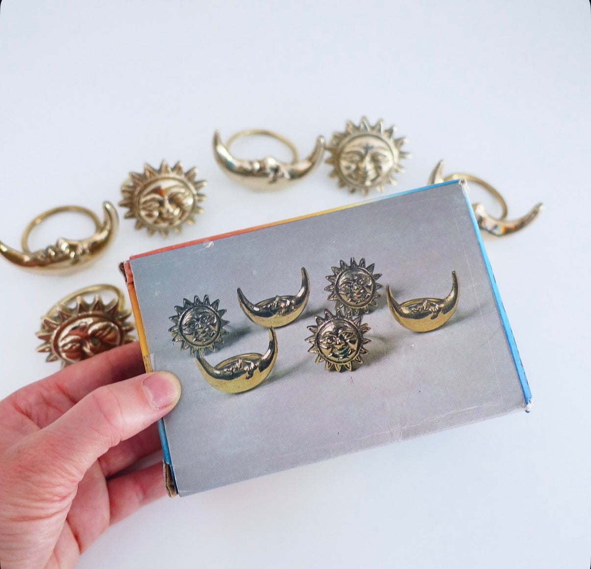 Set of six Celestial brass Sun & moon napkin rings
