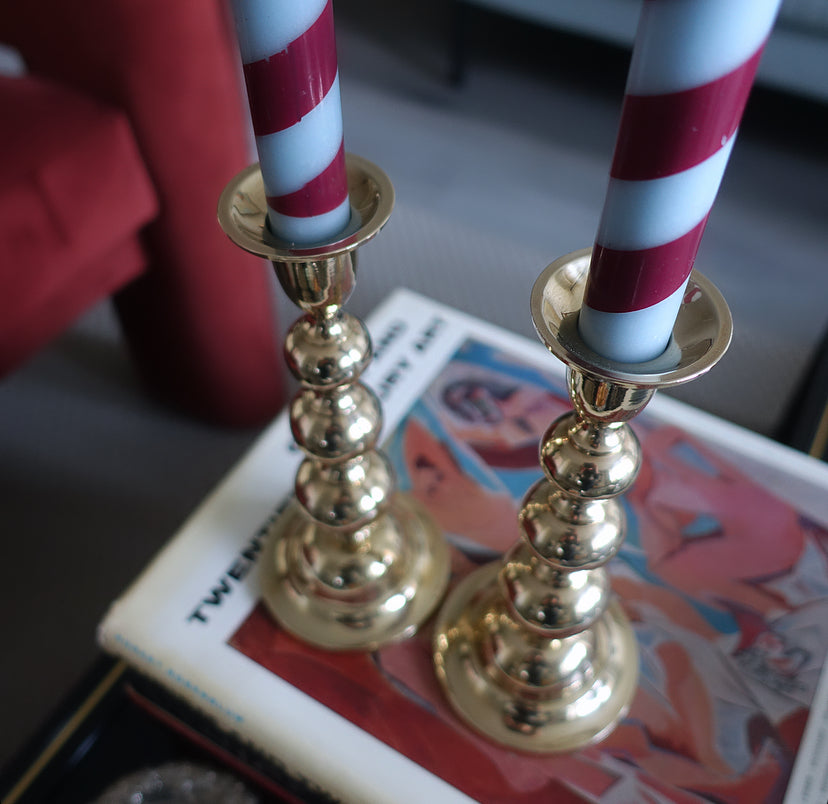 Pair of brass bobbin candle holders