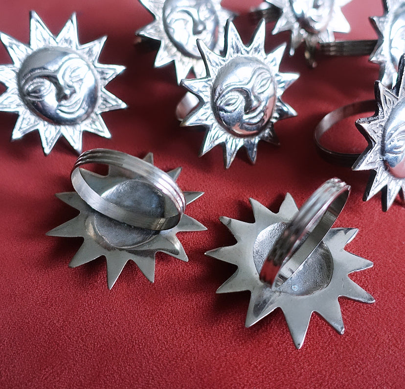 Set of eight sun napkin rings