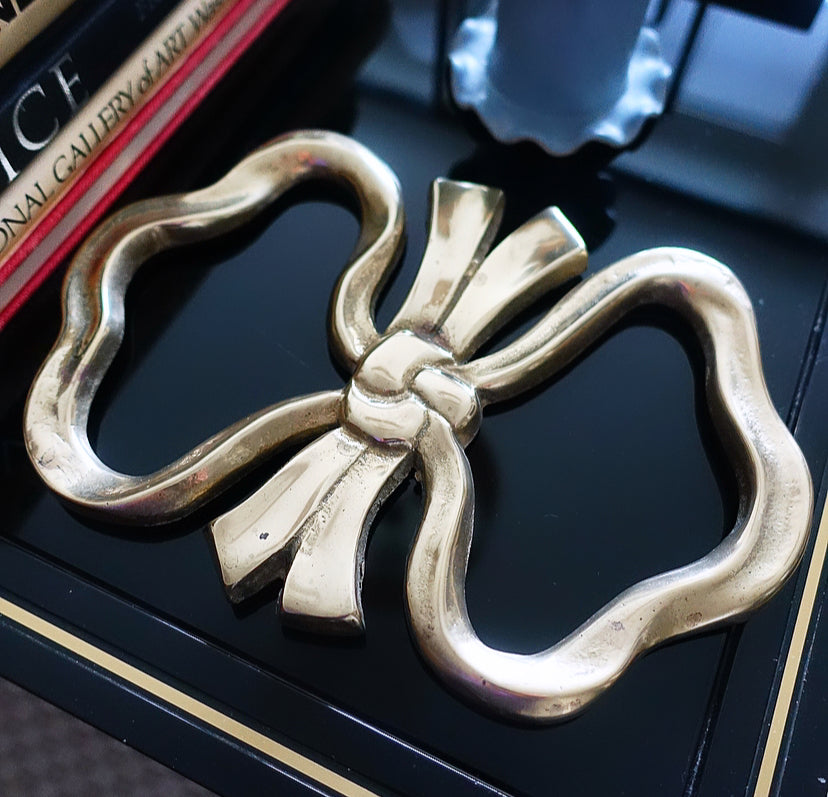 Large brass bow trivet