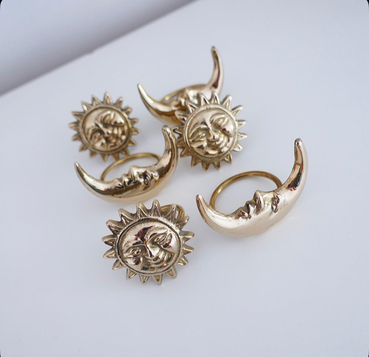 Set of six Celestial brass Sun & moon napkin rings