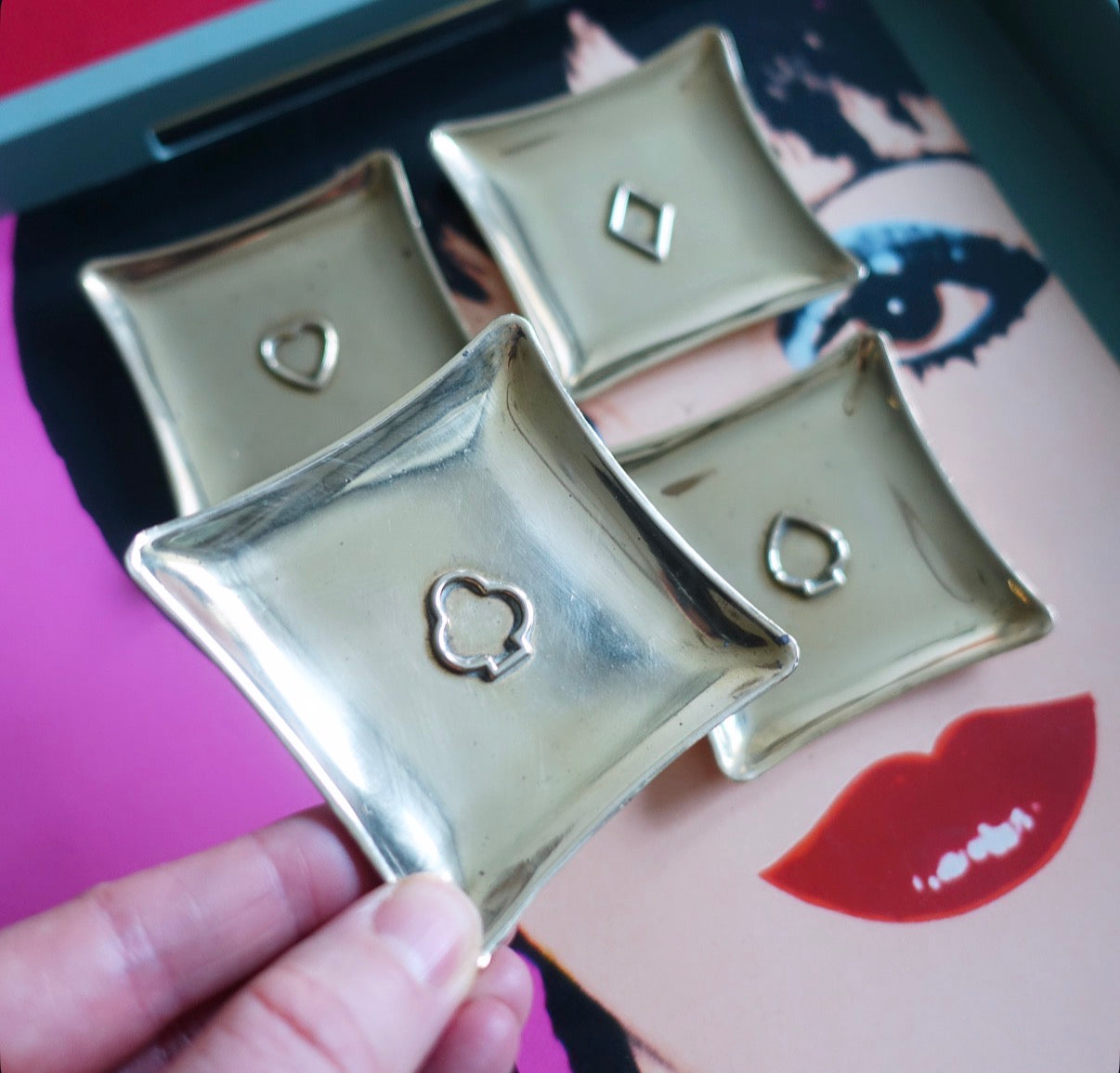 Set of four brass card suit trinket dishes