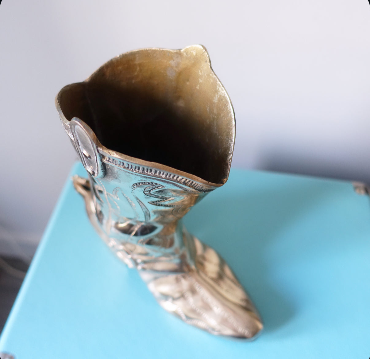 Large brass cowboy boot