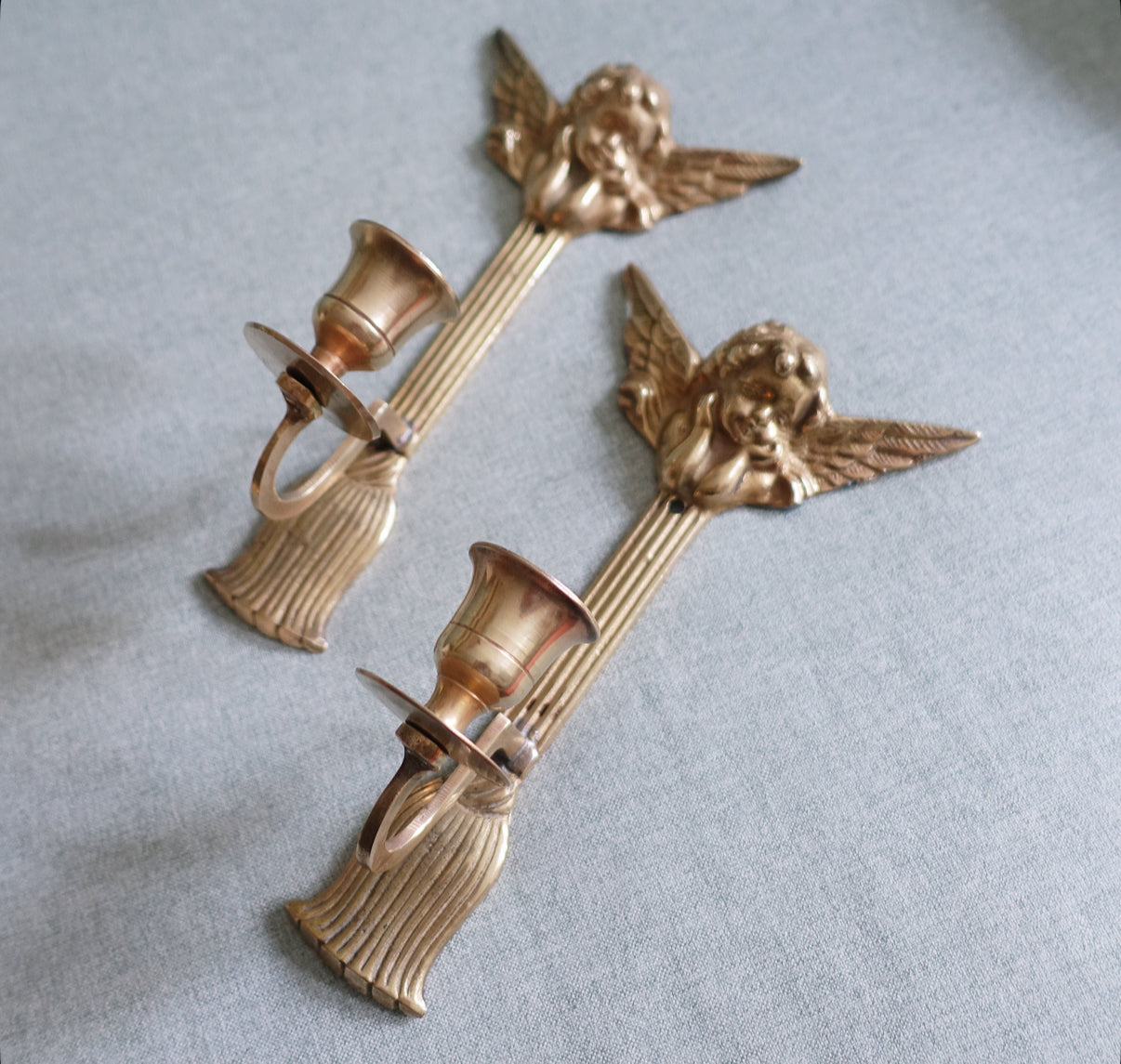 Brass cherub candle sconces