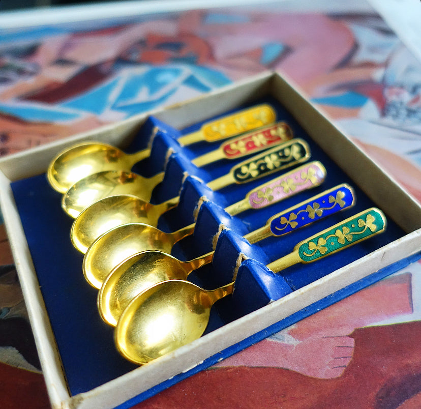 Set of six Danish gold plated and rainbow enamel lucky charm spoons