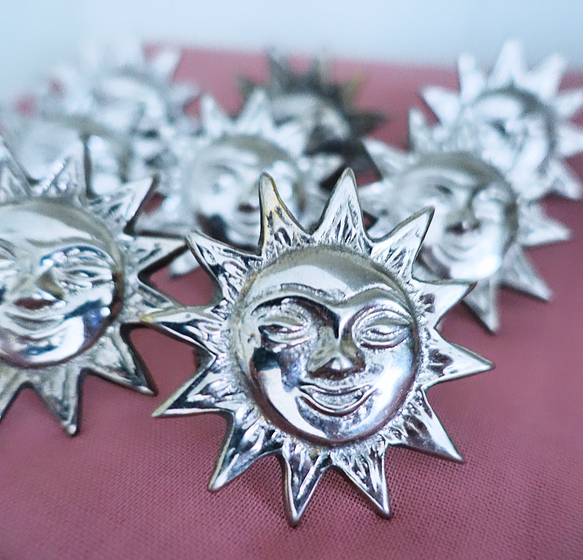 Set of eight sun napkin rings