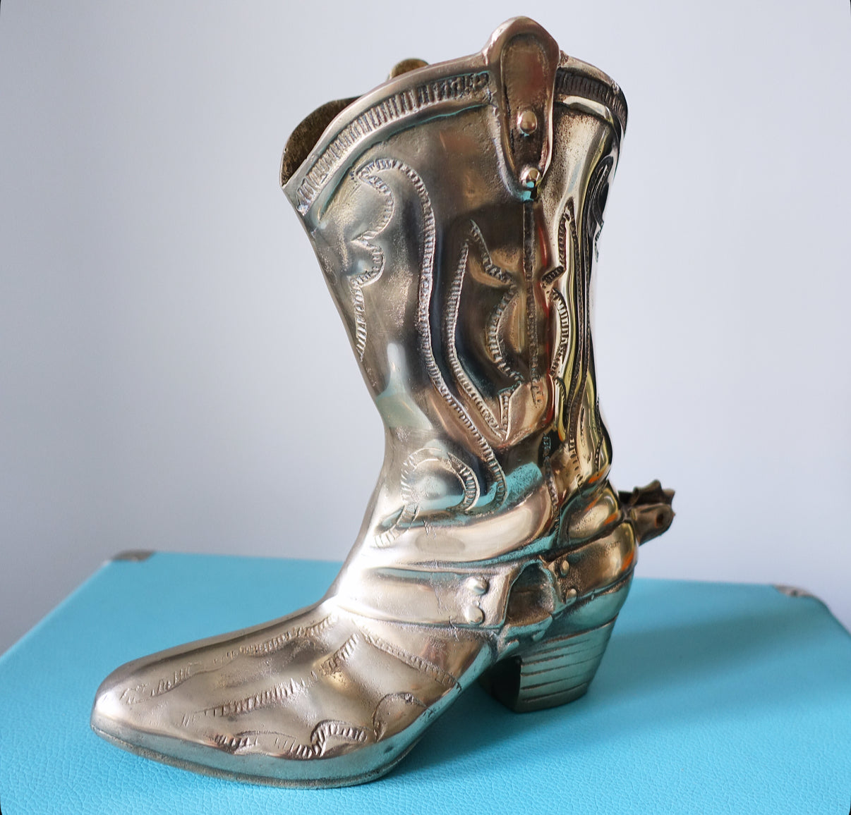 Large brass cowboy boot