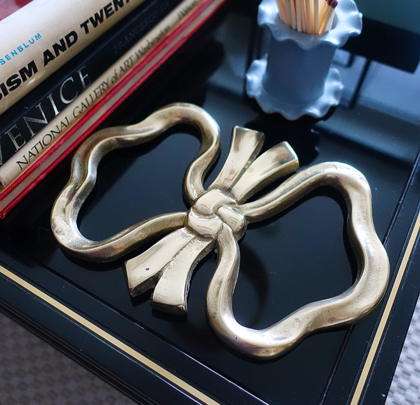 Large brass bow trivet