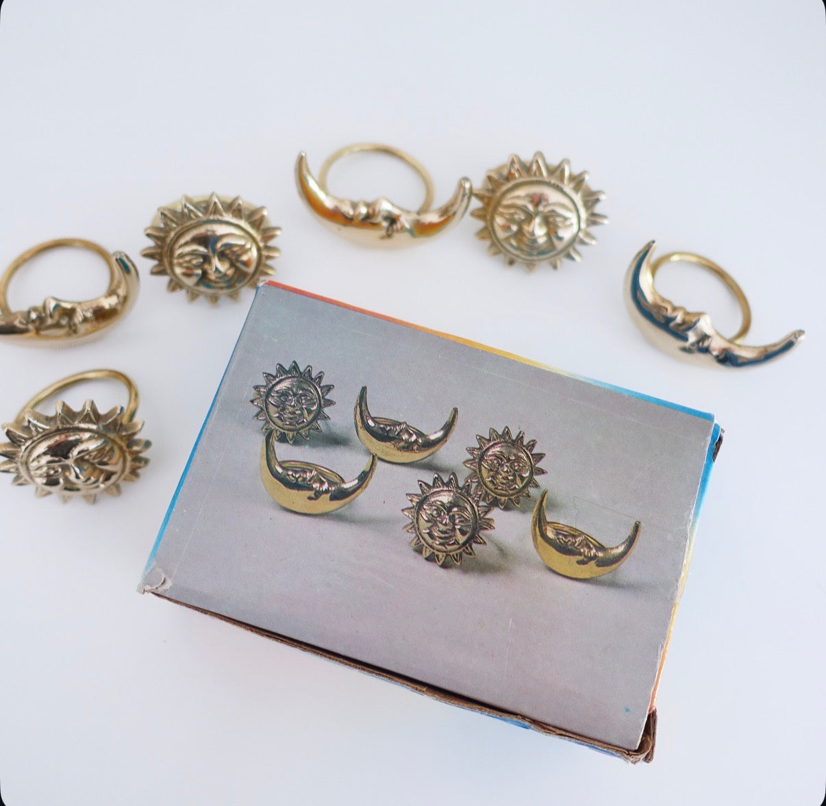 Set of six Celestial brass Sun & moon napkin rings