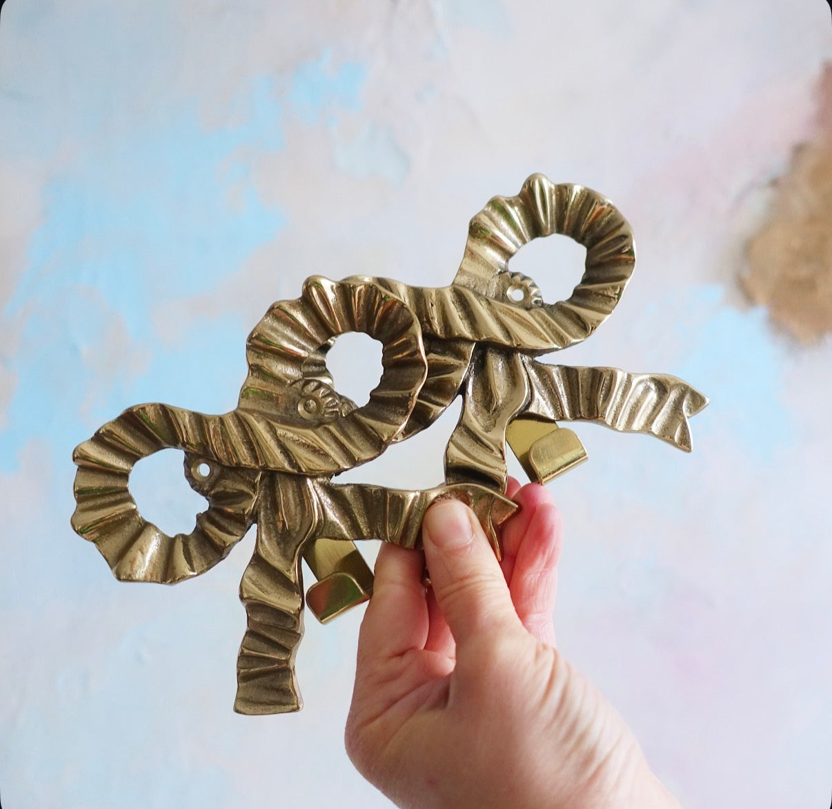 Brass bow wall hooks