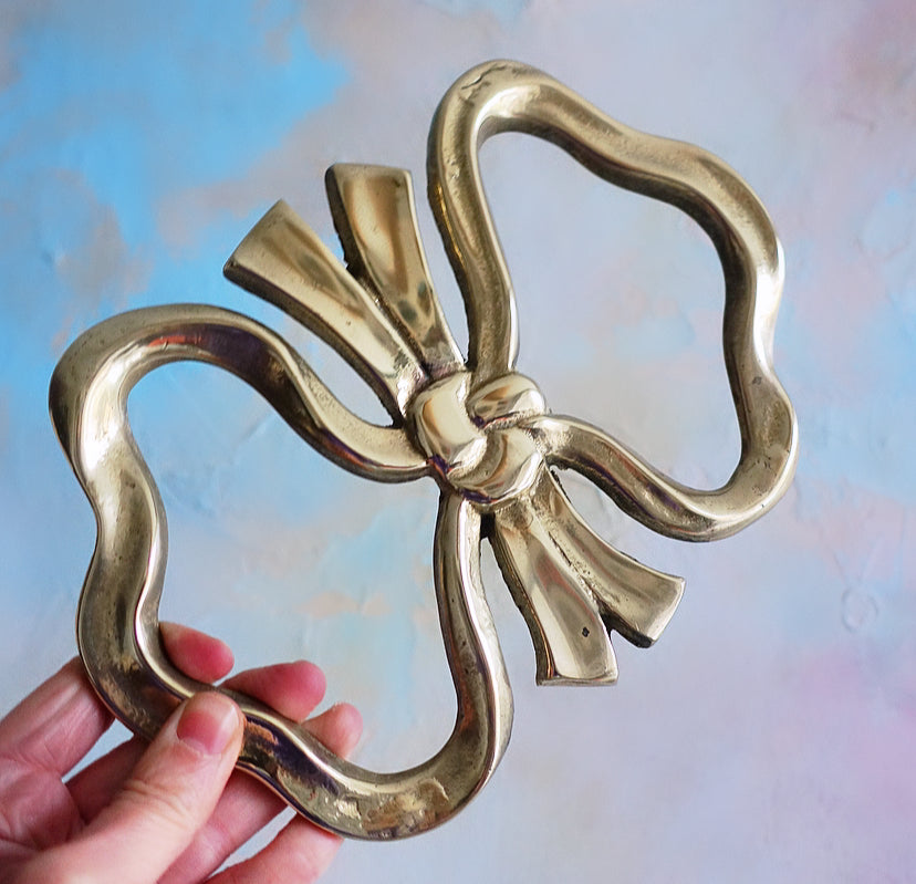 Large brass bow trivet