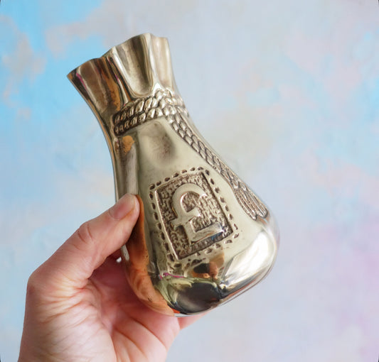 Brass swag bag coin bank