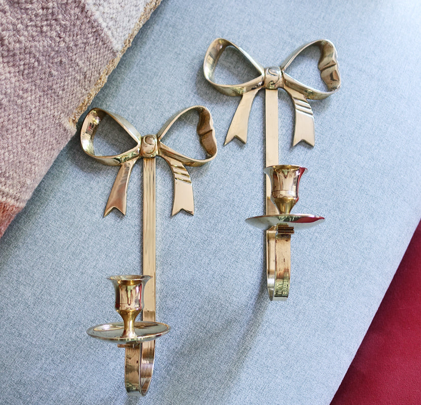 Pair of brass bow candle sconces