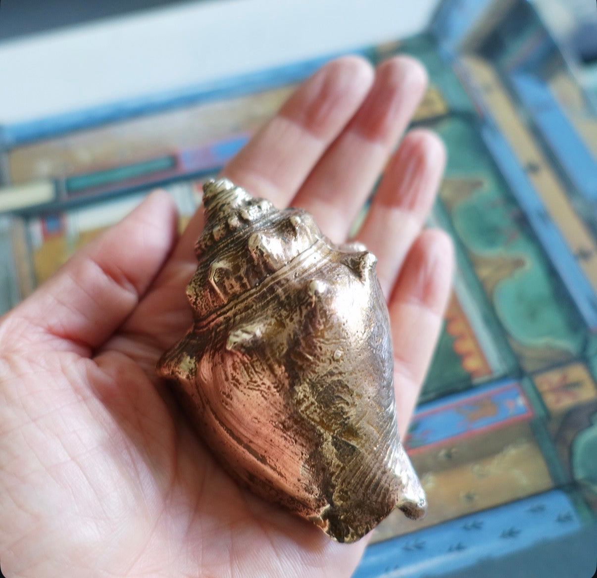 Brass conch shell paperweight
