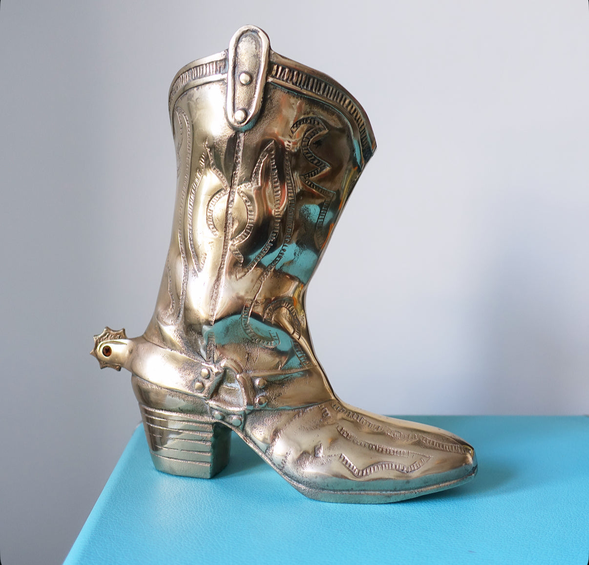 Large brass cowboy boot