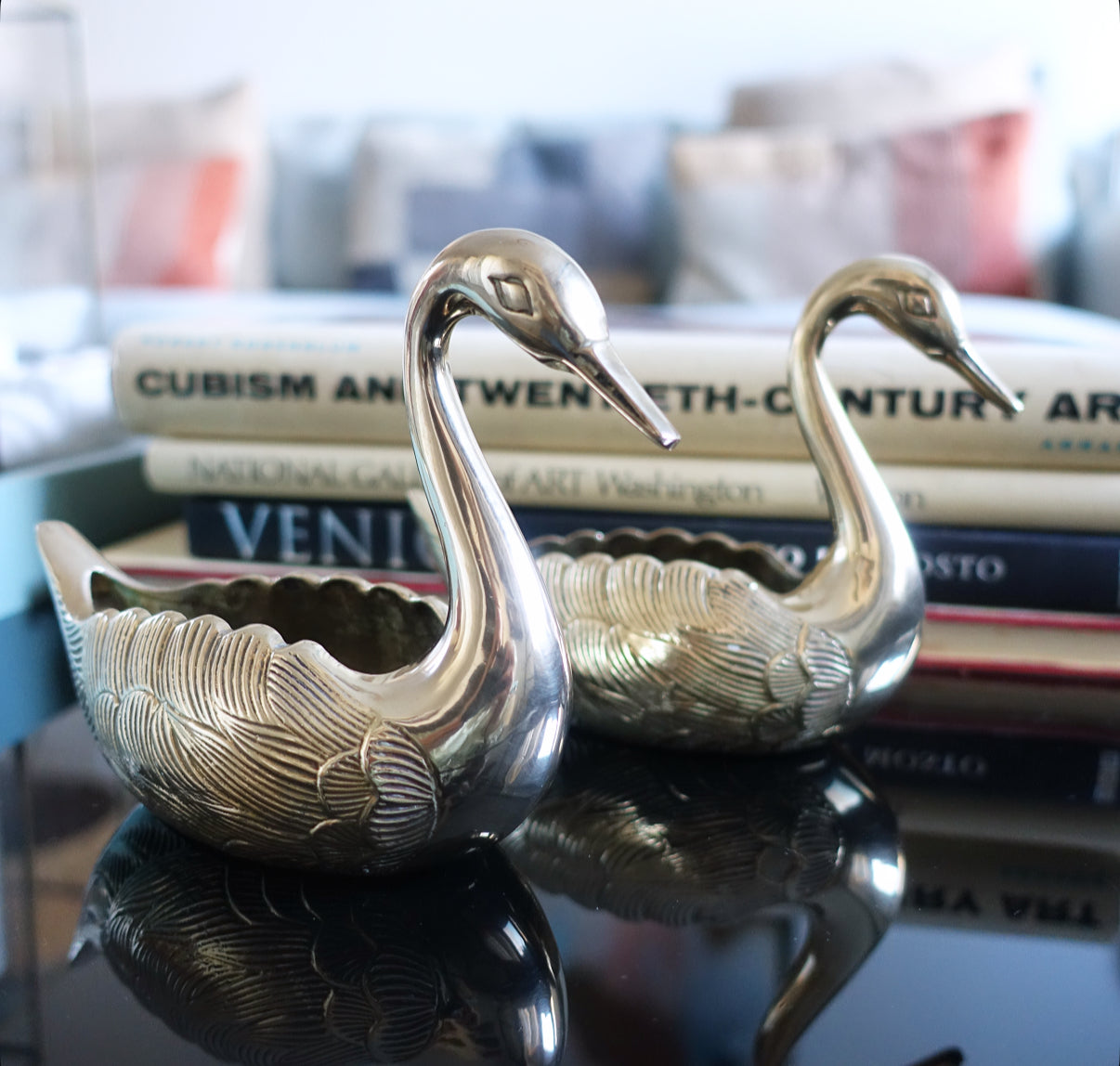 Pair of small brass swans