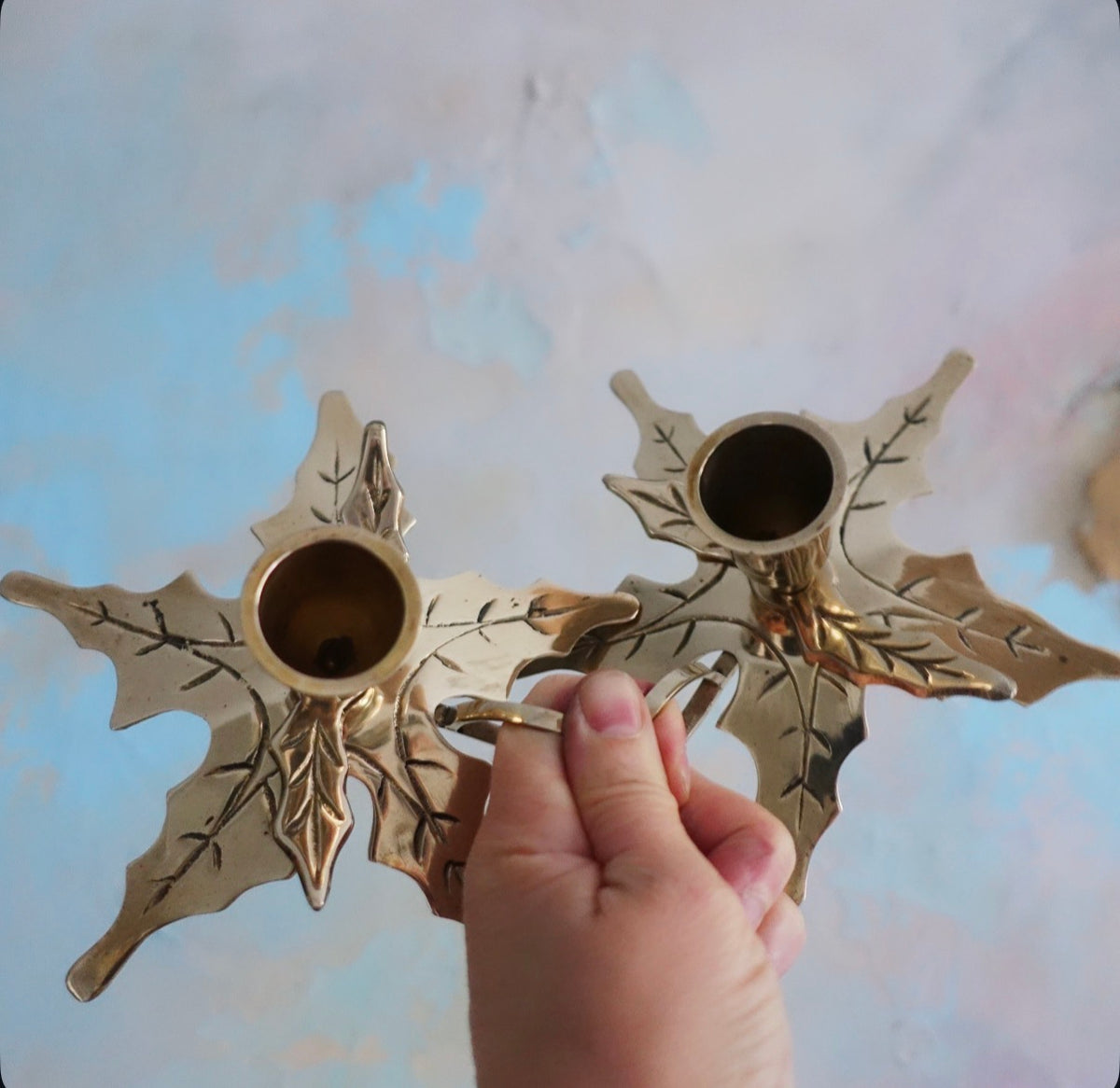 Pair of brass Holly candle holders