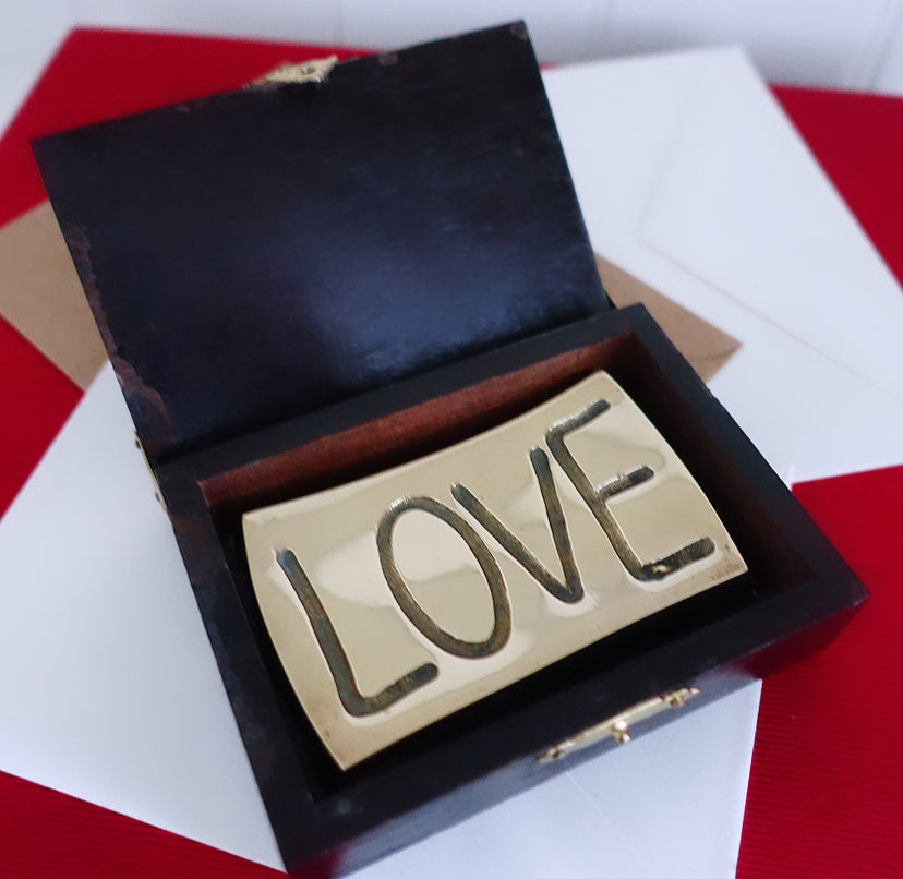 Brass love paperweight