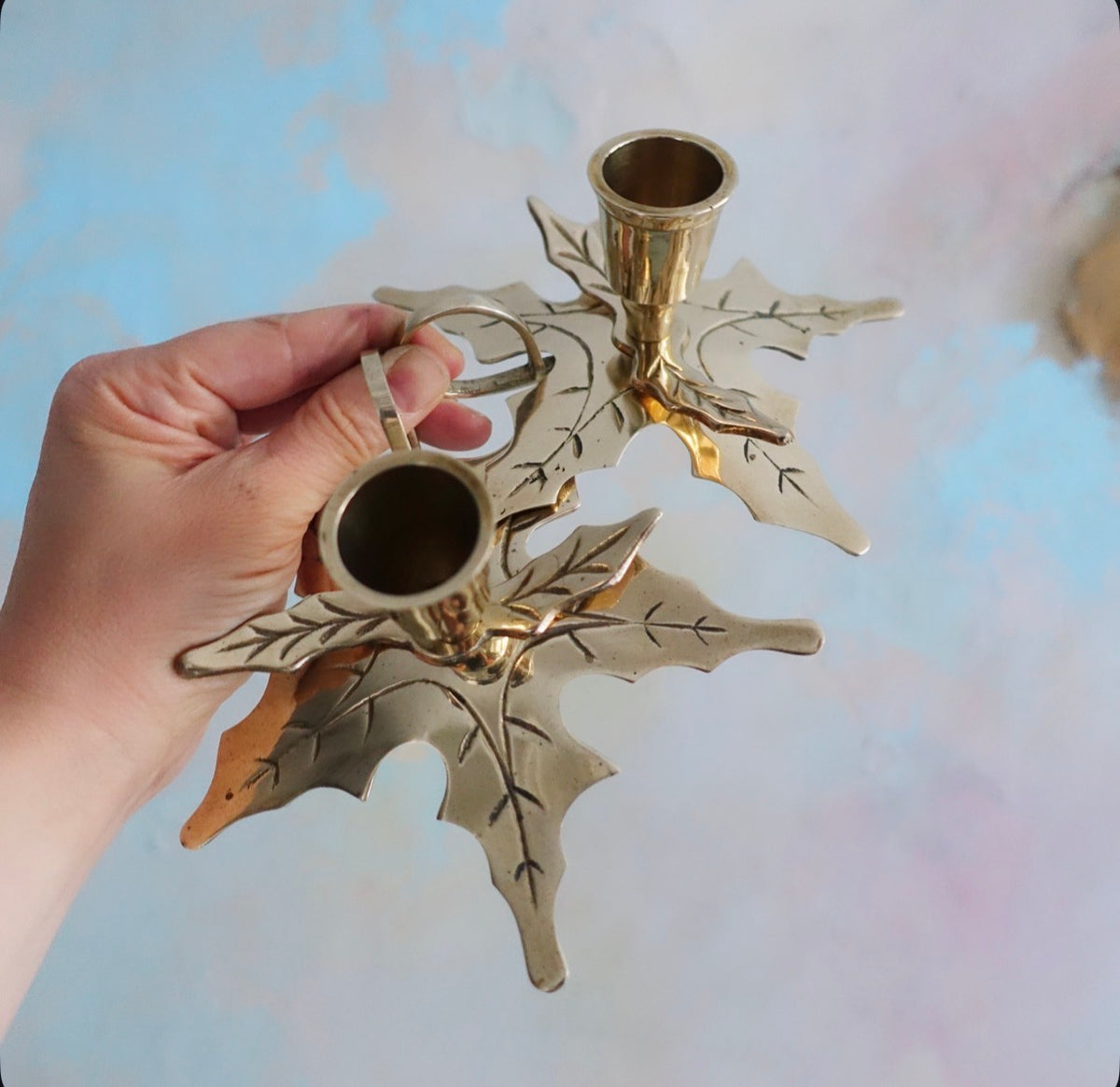 Pair of brass Holly candle holders