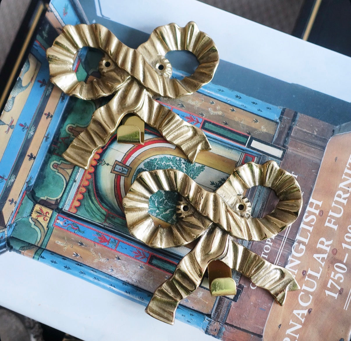 Brass bow wall hooks