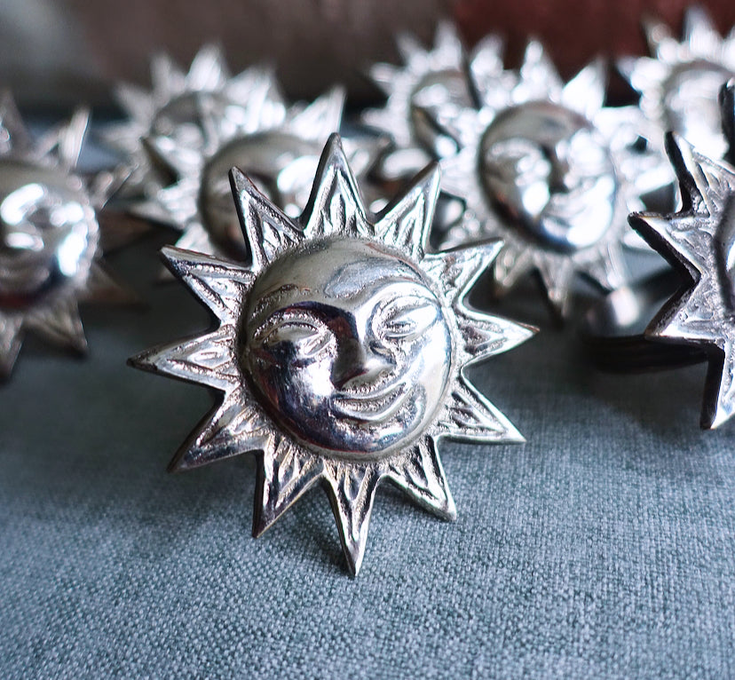 Set of eight sun napkin rings