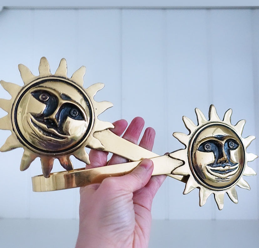 Pair of brass sun curtain tie-backs