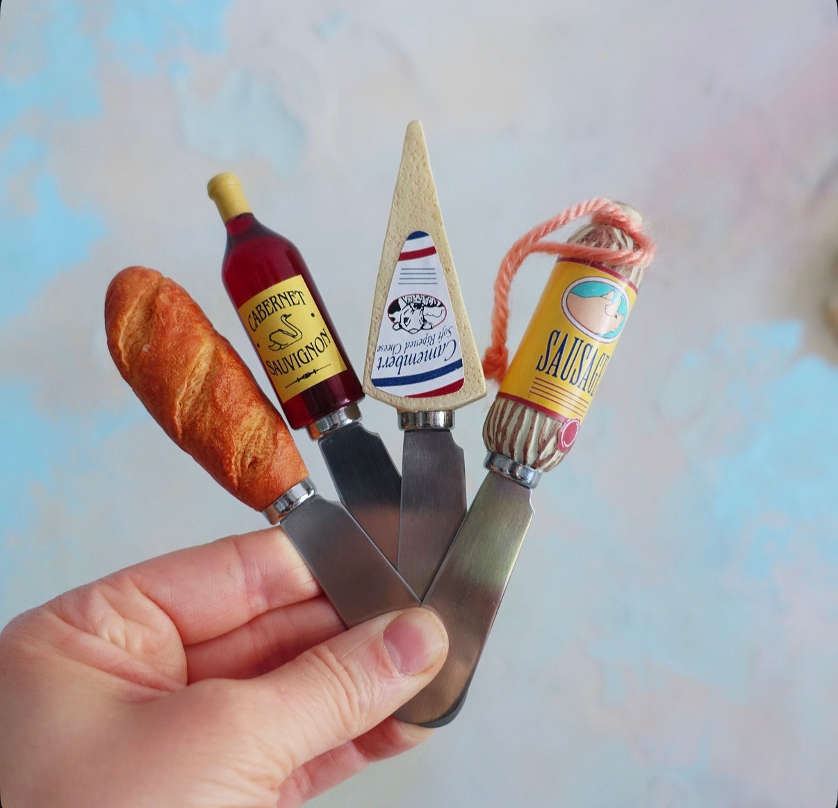 Set of four butter spreaders
