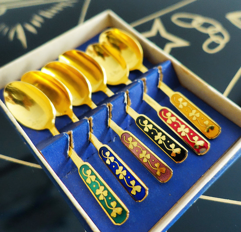 Set of six Danish gold plated and rainbow enamel lucky charm spoons