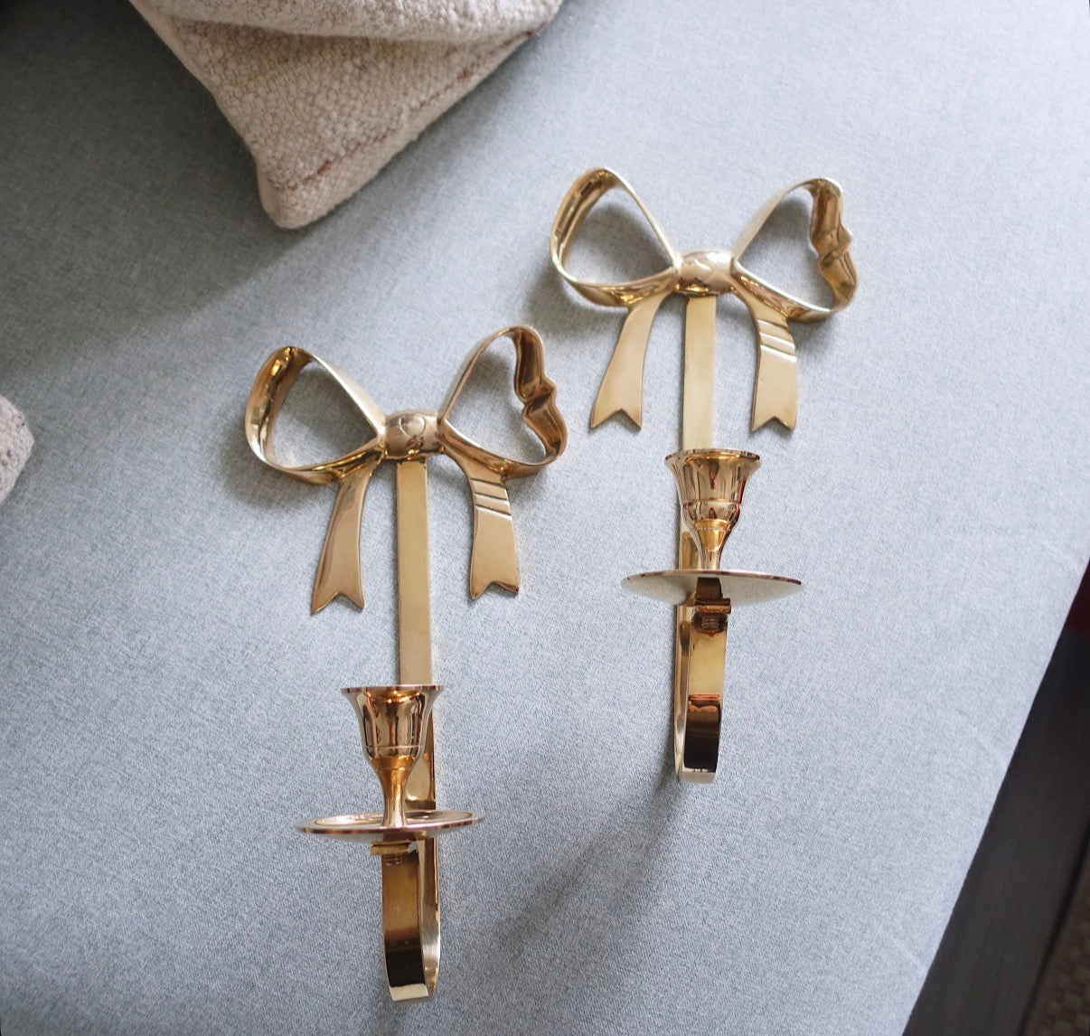 Brass bow candle sconces